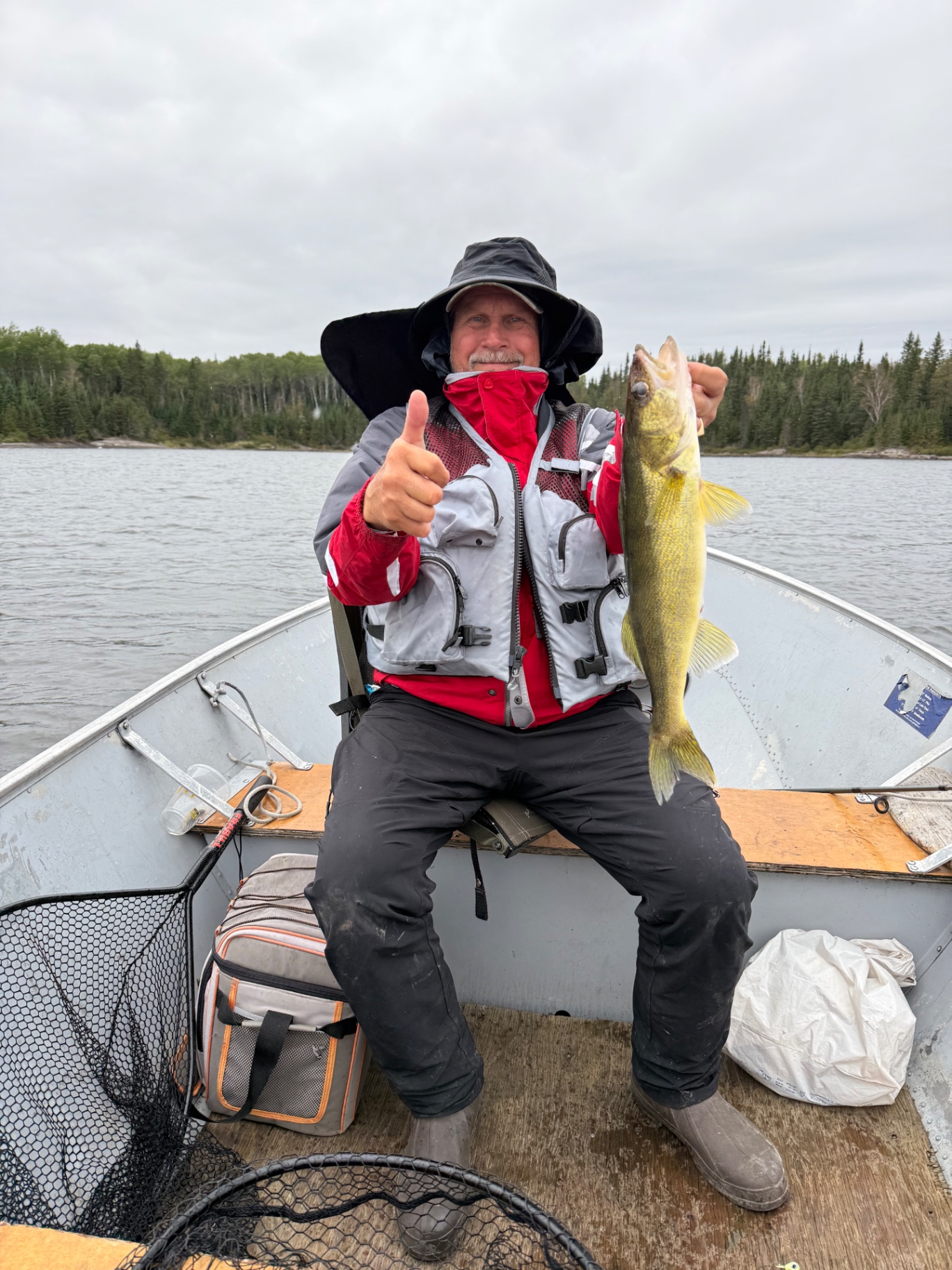 Thumbs up with a walleye in the boat